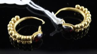 A pair of Roman solid gold and garnet set half hoop earrings, each with two gold bands of spheres