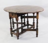 A WILLIAM & MARY YEW AND WALNUT OVAL GATELEG TABLE, CIRCA 1690, the oval yew wood top above a drawer