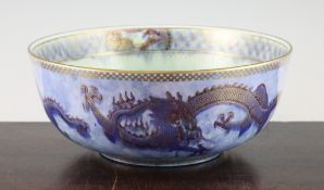 A Wedgwood dragon lustre bowl, designed by Daisy Makeig-Jones, decorated with dragons on yellow