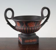 A Wedgwood Grecian revival black basalt and rosso antico `kantharos` bough pot, 19th century, with