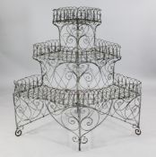 An early 19th century wrought iron work three tier plant stand, H.3ft 9in.