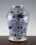 A Chinese blue and white baluster vase, 19th century, painted with phoenixes on a floral ground,