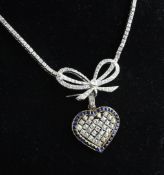 A white gold and diamond set line necklace with love knot terminal and heart shaped gold, sapphire