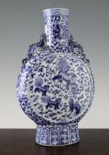 A large Chinese blue and white moonflask, 19th century, painted to each side with a Buddhist lion