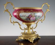A Sevres style porcelain and gilt metal mounted centrepiece bowl, the oval bowl painted with