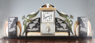 A French Art Deco marble and onyx clock garniture, the central square silvered dial with two train