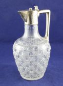 An early 20th century German silver mounted hobnail cut glass claret jug, of baluster form, with