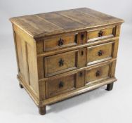 A late 17th century oak chest, of three drawers with moulded drawer fronts and ring handles, on