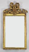 A 19th century giltwood wall mirror, with ribbon tied crest and an oval profile bust of a gentleman,