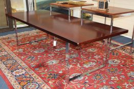 A 20th century Merrow Associates rectangular stained teak boardroom table, on chrome square