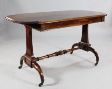A 19th century rosewood two drawer side table, the top with projecting bow ends over two frieze