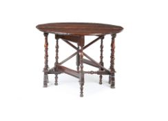 "A WILLIAM AND MARY OAK GATELEG TABLE, CIRCA 1700, the oval top is raised on a narrow frame with