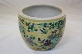 A Chinese famille verte glazed biscuit porcelain jardiniere, early 20th century, painted with