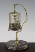 A mid 20th century brass bird cage timepiece, with grey marble plinth, 10in.