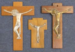 Dunstan Pruden (1906-1974)silver, bronze and wood,Three Crucifixes,largest 6.75in.