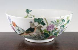 A Chinese famille rose punch bowl, 20th century, painted inside and out with birds amid flowers,