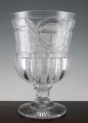 A large George IV cut glass presentation goblet, with an oval reserve wheel engraved with the