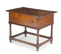A GEORGE II OAK BOX TABLE, CIRCA 1740, the triple plank lift-off top above a deep dummy drawer, on
