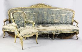 A Louis XV design giltwood salon suite, comprising a large settee with open arms and stressed fabric