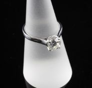 An 18ct white gold and solitaire diamond ring, the round cut stone weighing approximately 1.00ct,