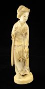 A large Japanese Tokyo School ivory figure of a bijin, early 20th century, wearing a kimono and