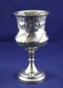 An Edwardian silver goblet, of urn shape, embossed with scrolling foliage and fruit, William