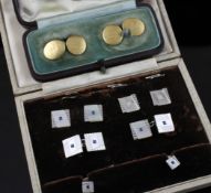 A cased 1930`s 9ct white gold, mother of pearl and gem set eight piece dress stud set, of square