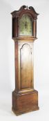 Daniel Turner, Lynn. A George III oak eight day longcase clock, the 12 inch arched brass dial with