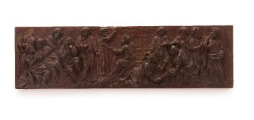 A FLEMISH CARVED OAK PANEL, LATE 16TH CENTURY, carved in high relief and depicting Christ washing