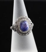 An early 19th century gold and silver, sapphire and diamond cluster dress ring, of oval design,