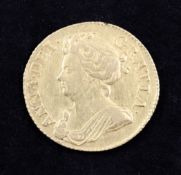A Queen Anne gold guinea coin, 1714, rare part of last letter A missing, good EF, 8.4g