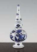 A Chinese blue and white rose water sprinkler, Kangxi period, of bottle form, decorated with