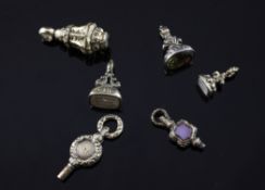Four Victorian gold overlaid citrine or carnelian set fob seals and two watch keys, largest 1.25in.