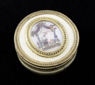 A French 18th century circular ivory and gilt brass mounted box and cover, the lid inset with an