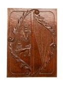 A QUEEN ANNE CARVED OAK ARMORIAL PANEL, EARLY 18TH CENTURY, carved with a lion and a thistle to