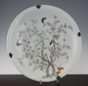 A Chinese famille rose dish, Yongzheng seal mark but later, painted with butterflies amid blossoming