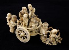 A Japanese ivory group of a carriage procession, early 20th century, with the figures of four