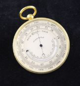 A late Victorian gilt brass pocket barometer and thermometer, with silvered dial, in a circular