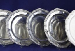 Twelve George II silver dinner plates, of shaped circular form, engraved with the Kentbury or