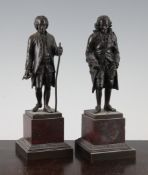 After Rosset. A pair of 19th century bronze figures of Rousseau and Voltaire, on square red marble