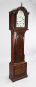 Casm. Prada. High Wycomb. A George III mahogany eight day longcase clock, the 12 inch arched painted