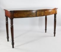 An early 19th century mahogany bow fronted serving table, with ebony line inlay, on turned supports,
