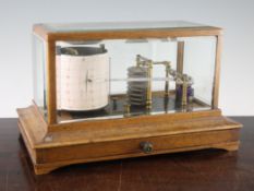 An Edwardian oak cased barograph, with base drawer and label for Mumford of Tiverton, 14in.