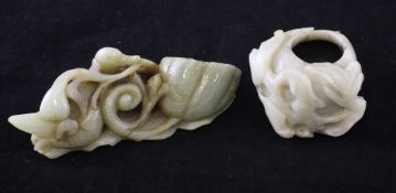 A Chinese celadon jade carving and a pale grey jade brushwasher, the first carved as a duck biting