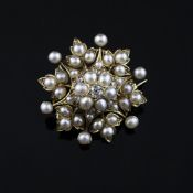 A cased late Victorian gold, diamond and split pearl set cluster pendant brooch, of foliate