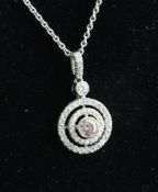 A white gold, pink and white diamond set target pendant, with GIA certificate stating the very light