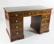 An Edwards and Roberts mahogany and satinwood inlaid pedestal desk, with green leather and gilt