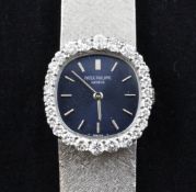 A lady`s 18ct white gold and diamond set Patek Philippe manual wind dress wrist watch, the rounded