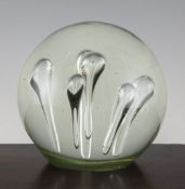 A large Victorian glass dump paperweight, with six internal glass bubble inclusions, 6.5in.