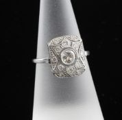 A 1920`s 18ct white gold and diamond set tablet ring, of rectangular form, the central round cut